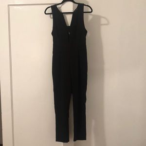 Black peel-a-boo jumpsuit never before worn!